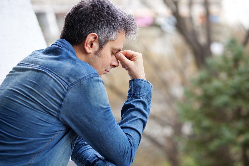 Visibly stressed men with greying hair